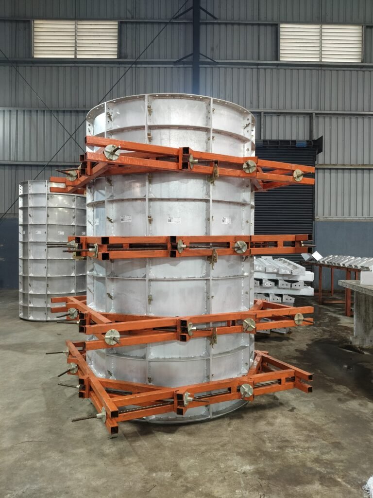 A circular aluminium column box with orange steel walers in the Navkaar factory